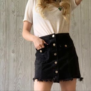 Distressed denim skirt with buttons